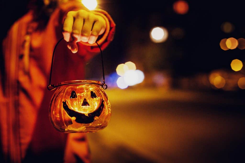 little girl holding halloween candle holder picjumbo com